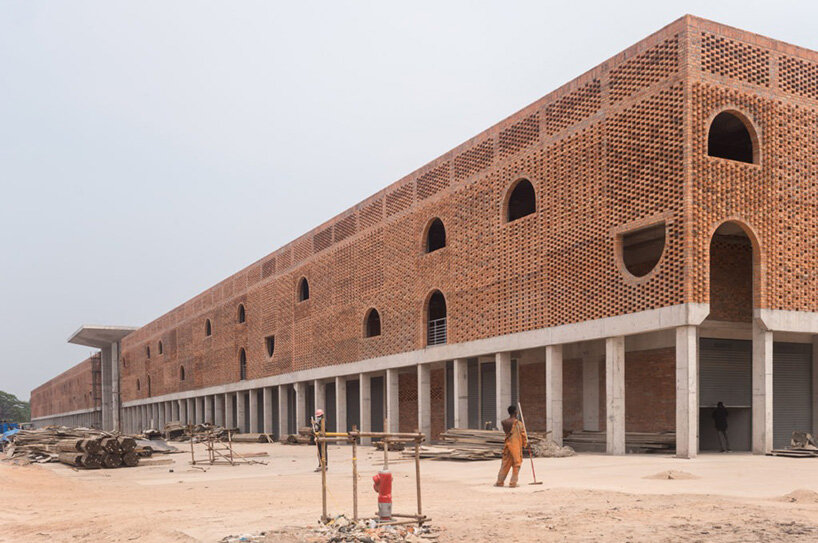concrete canopies and porous brick walls form central market redevelopment in congo