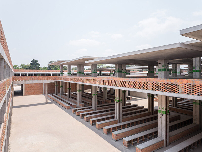 concrete canopies and porous brick walls form central market redevelopment in congo