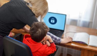 Child on computer with mother