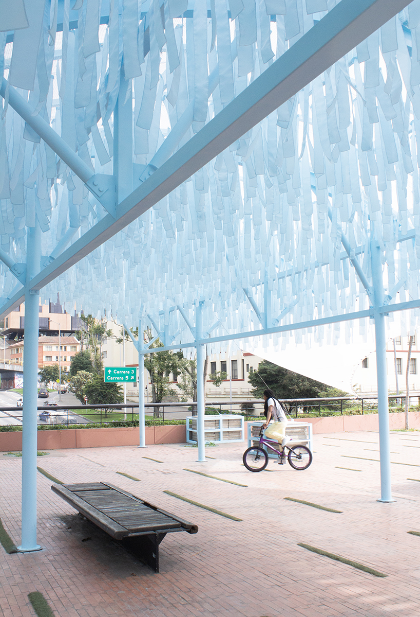 blue fabric fragments dance with the wind on modular cultural pavilion in colombia