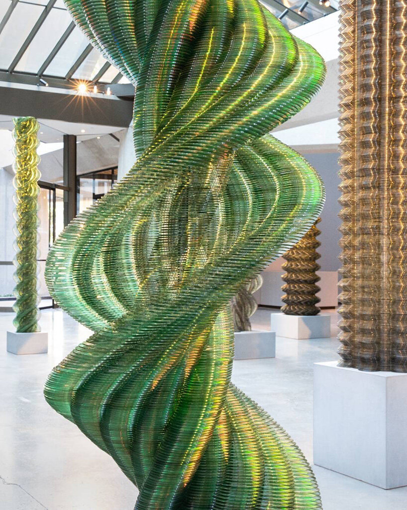 thousands of recycled CDs form reflective vertical sculptures in tara donovan's stratagems