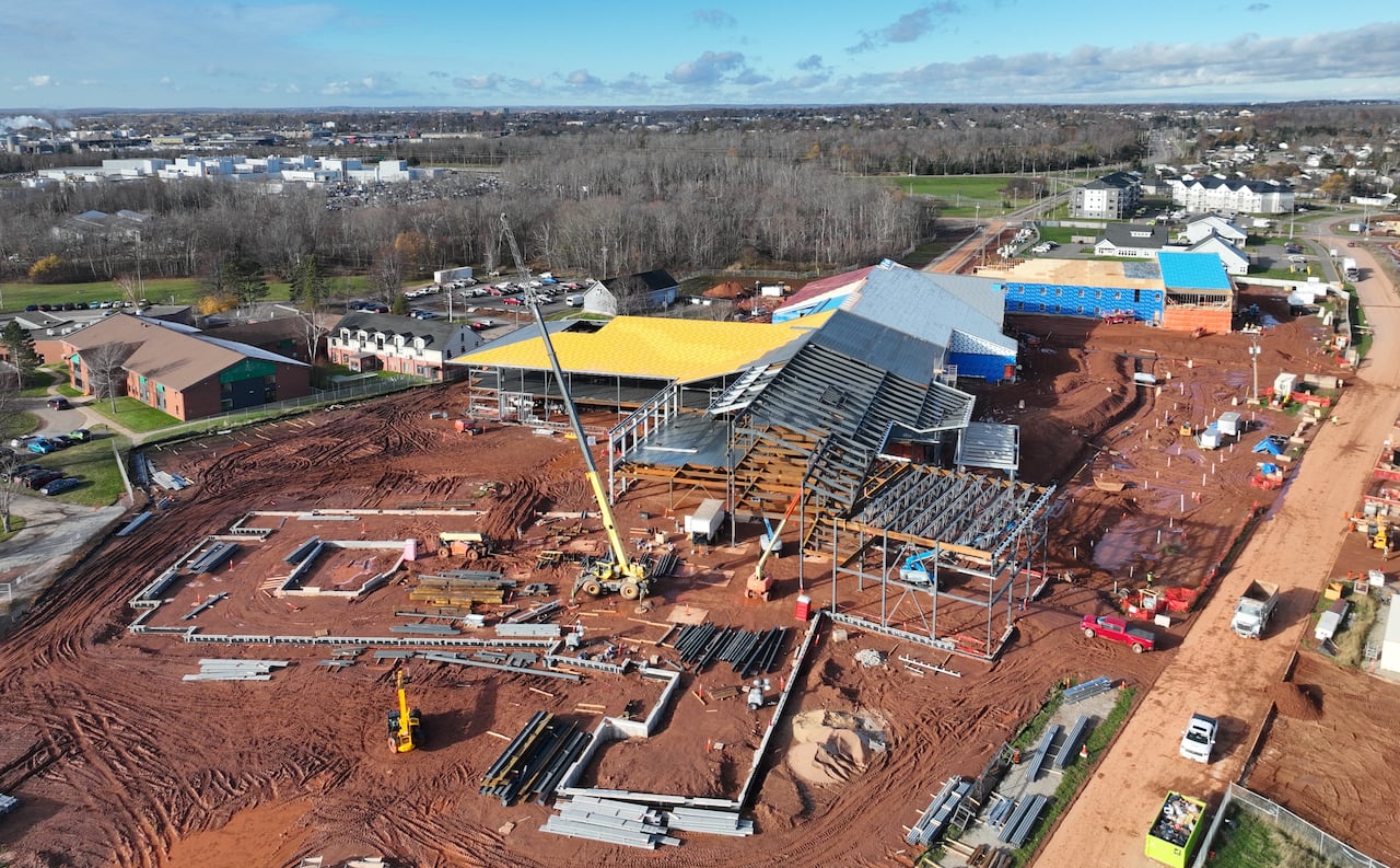 Equipment and building supplies can be seen at the construction site of a building.