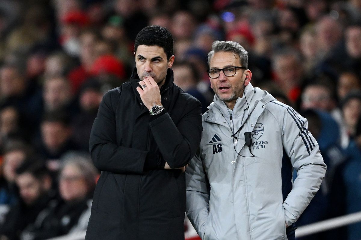 Mikel Arteta, Manager of Arsenal, and his assistant Albert Stuivenberg look on during the Premier League match between Arsenal and Brighton & Hove Albion at the Emirates Stadium on December 27, 2025 in London, England. 