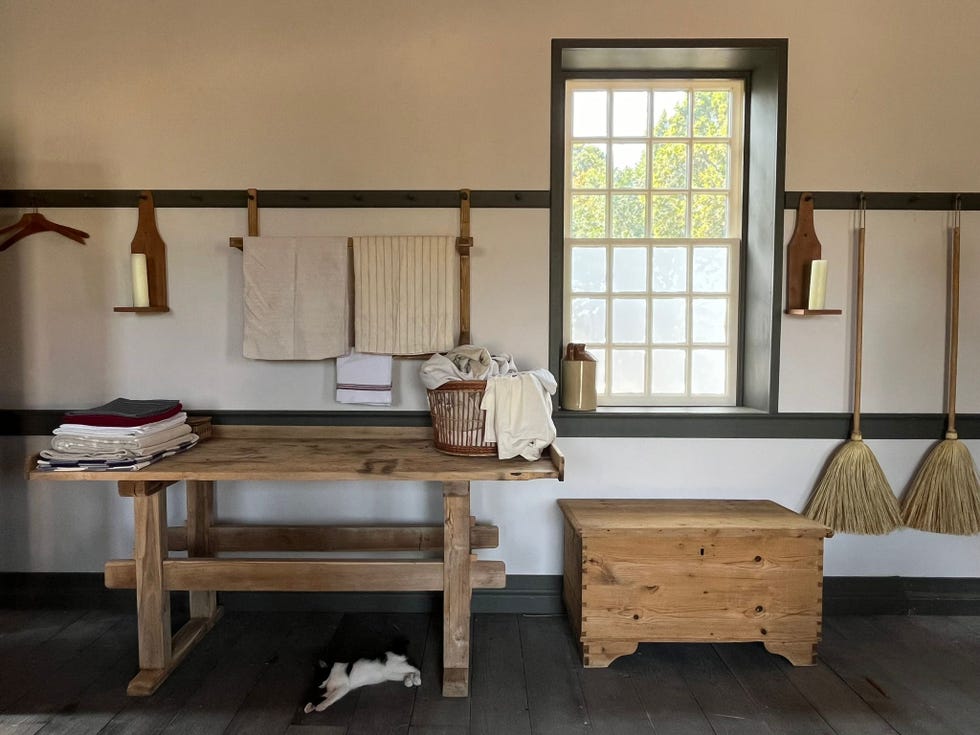 interior of a rustic laundry room with various items on display
