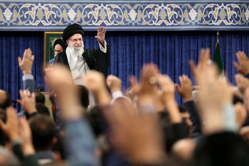 Iran's Supreme Leader Ayatollah Ali Khamenei waves during a meeting in Tehran, Iran, in May 2025.
