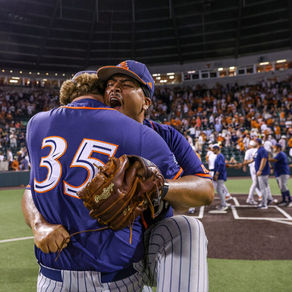 Two UTSA baseball players hug after defeating Texas