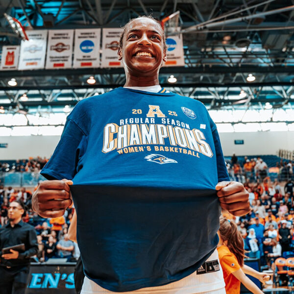 Jordyn Jenkins shows off her conference championship shirt