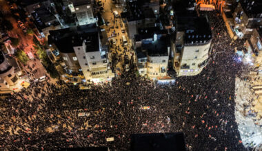 A drone view shows Ultra-Orthodox Jewish men as they protest against pressure to conscript men from their community into I...