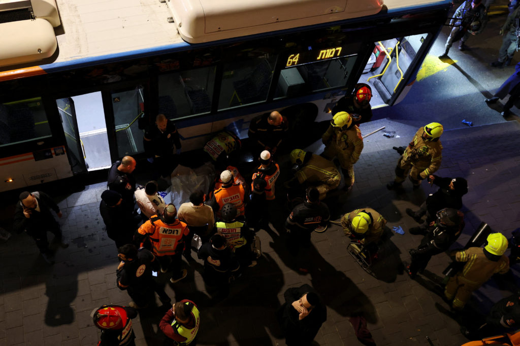 Emergency responders attend the scene where, according to Israel's ambulance service, a man was killed in a collision invo...