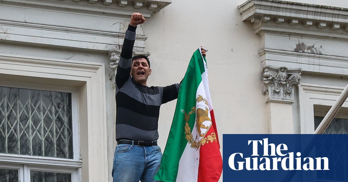 Protester pulls down national flag from Iranian embassy in London | Iran