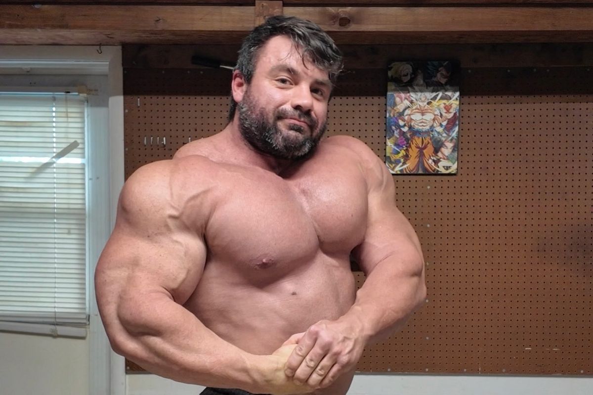 Bodybuilder Jason Lowe flexing his enormous bicep