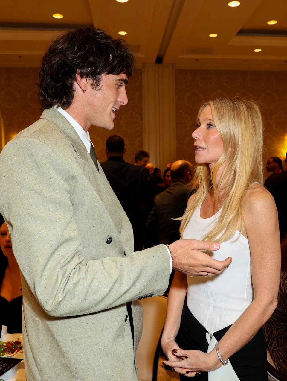 Jacob and Gwyneth Paltrow in conversation at a formal event