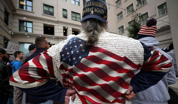 People gather at an event marking five years since the January 6th attack on the U.S. Capitol.
