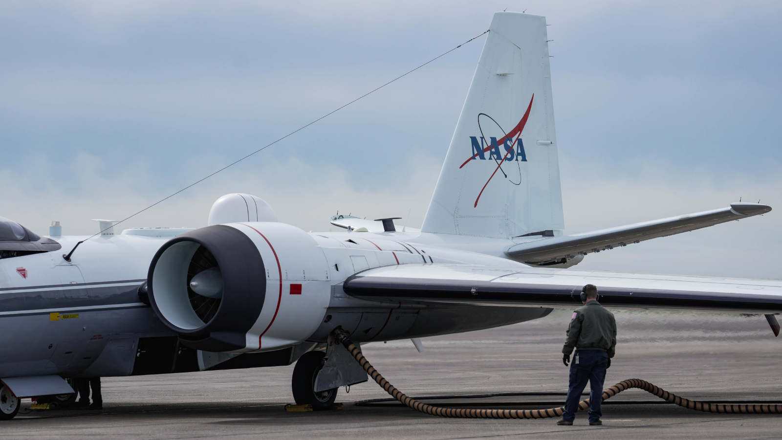 Photograph of the WB-57 jet on a runway being prepper for take off