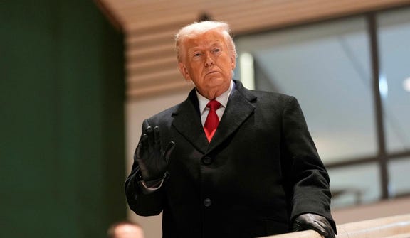 U.S. President Donald Trump walks down the stairs after a meeting during the Annual Meeting of the World Economic Forum in Davos, Switzerland, Wednesday.