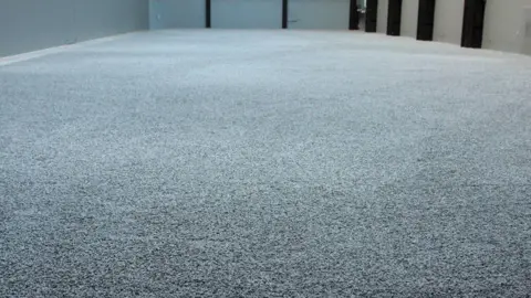 The 2010-11 installation Sunflower Seeds, by Ai Weiwei, part of the Unilever Series of installations in the Turbine Hall at the Tate Modern art gallery in London