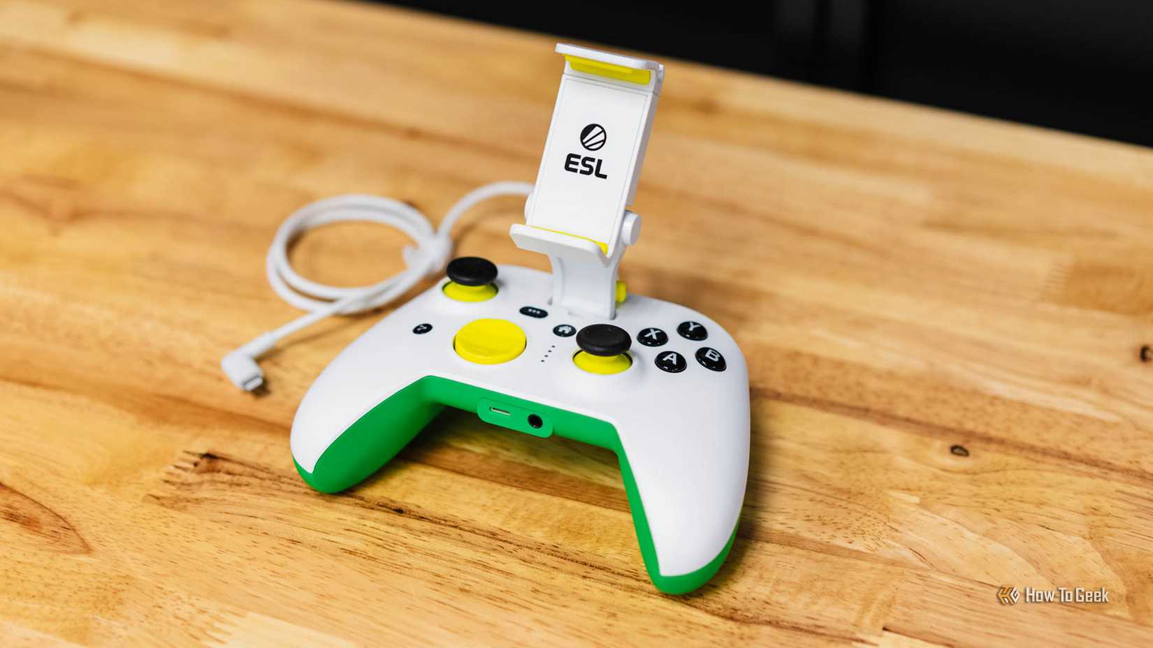 RiotPWR ESL Gaming Controller for iOS with phone stand attached.