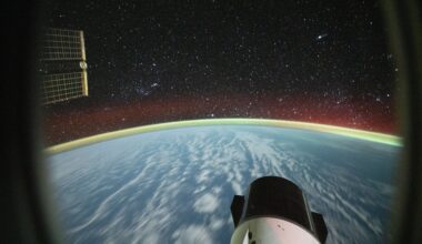 Long-exposure photograph from the International Space Station with a SpaceX Dragon cargo spacecraft visible in the lower foreground. Credit: NASA