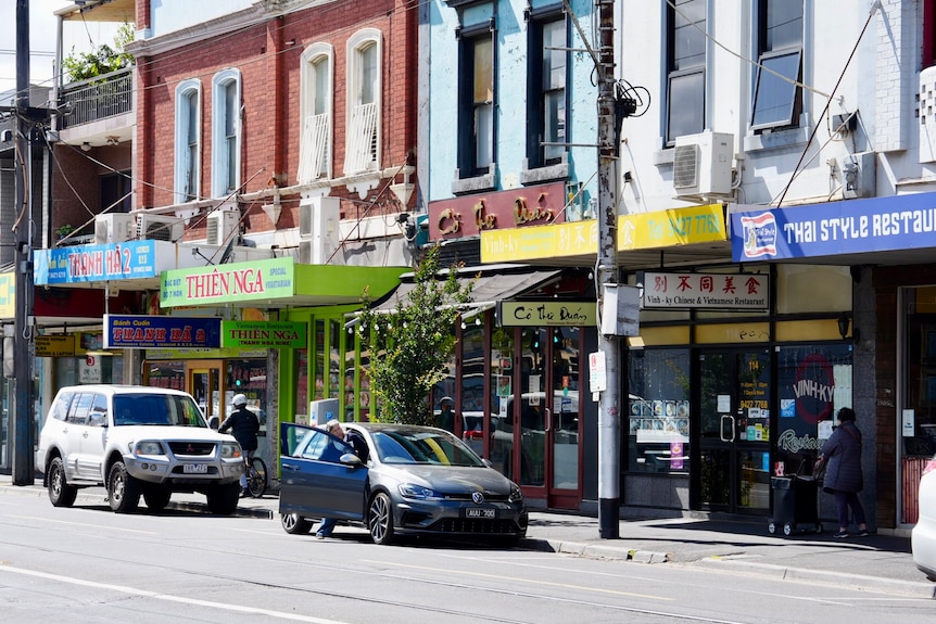 Cars parked outside restaurants in Victoria Street, Richmond