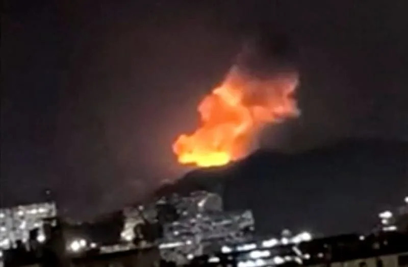 A column of smoke rises during multiple explosions in the early hours of the morning, in Caracas, Venezuela, January 3, 2026 in this screen grab obtained from video obtained by Reuters. (credit: Video Obtained by REUTERS )