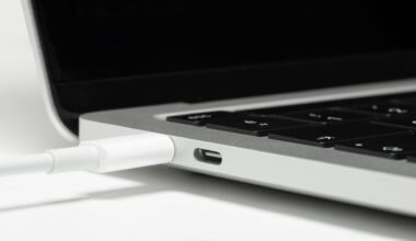 A photo of a MacBook laptop being charged.