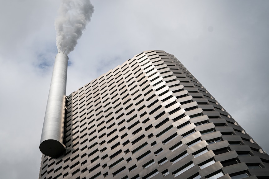 A building with a smokestack on its exterior.