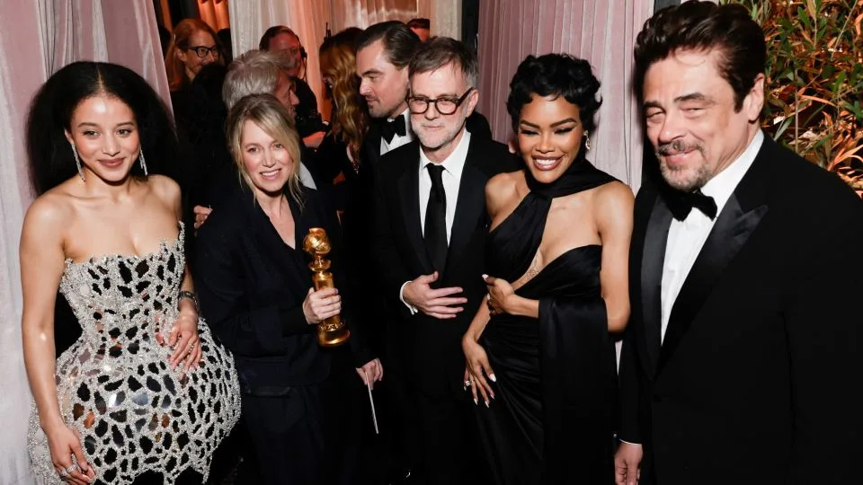 Chase Infiniti, Sara Murphy, Leonardo DiCaprio, Paul Thomas Anderson, Teyana Taylor and Benicio del Toro at the Golden Globes on Sunday. - Francis Specker/CBS