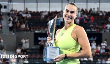 Aryna Sabalenka holds the trophy after winning the Brisbane International