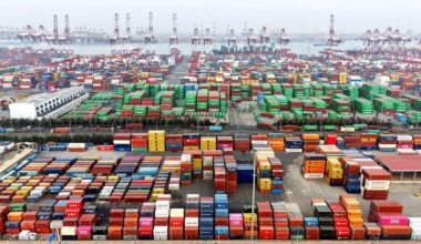 Containers are loaded at the hustle and bustle of Qingdao port in East China