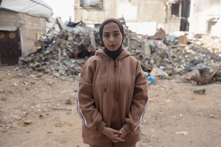 Batoul Abu Shawish, 20, lost her entire family in an Israeli strike that targeted their home in Nuseirat during the ceasefire in November 2025 [Abdelhakim Abu Riash/ Al Jazeera]