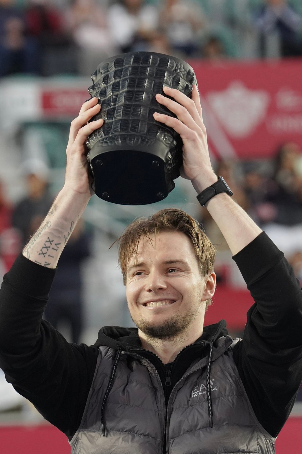 Alexander Bublik shows off the latest addition to his fast-filling trophy cabinet. Photo: Karma Lo