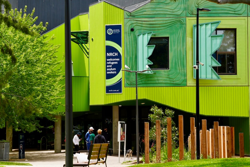 A bright green building housing the Medically Supervised Injecting Room.
