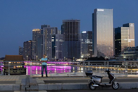 A man cuts a solitary figure at the Canal Business District in east Beijing’s Tongzhou district.