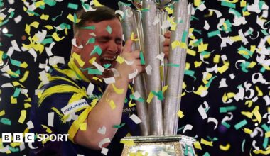 Luke Littler celebrates winning the 2026 PDC World Championship as tickertape falls