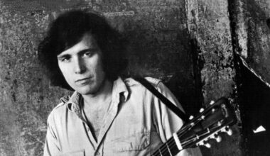 Don McLean posing with an acoustic guitar, 1971
