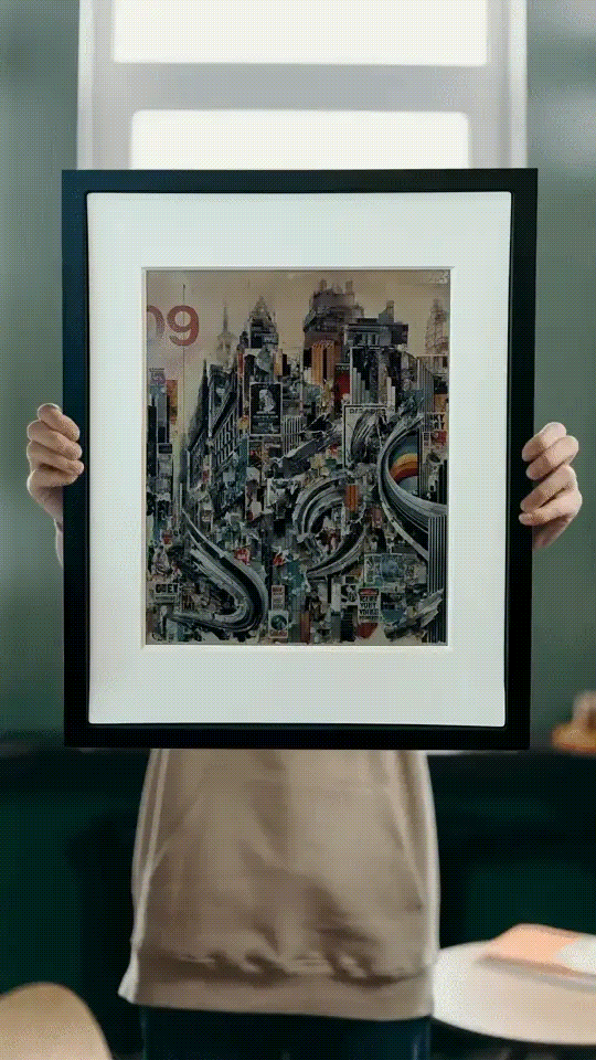 A framed E-ink panel switching from one piece of AI “art” to another.