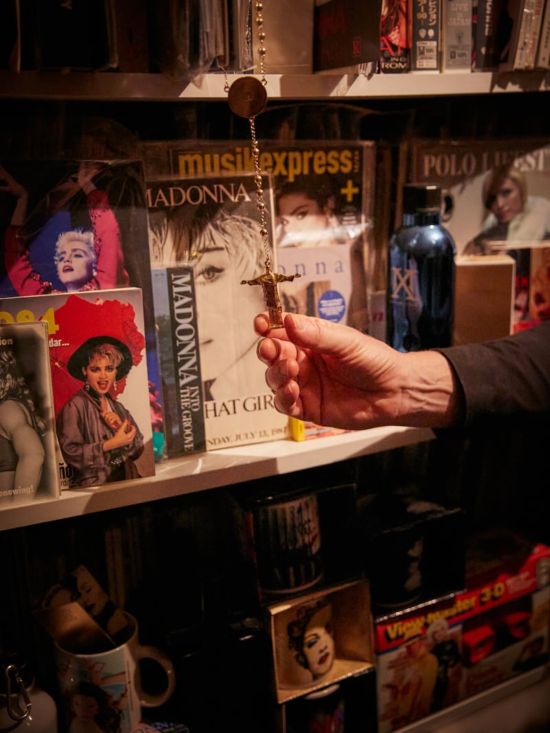 James Harknett shows off particular items in his collection of memorabilia. Photograph: Alice Zoo/New York Times
                      