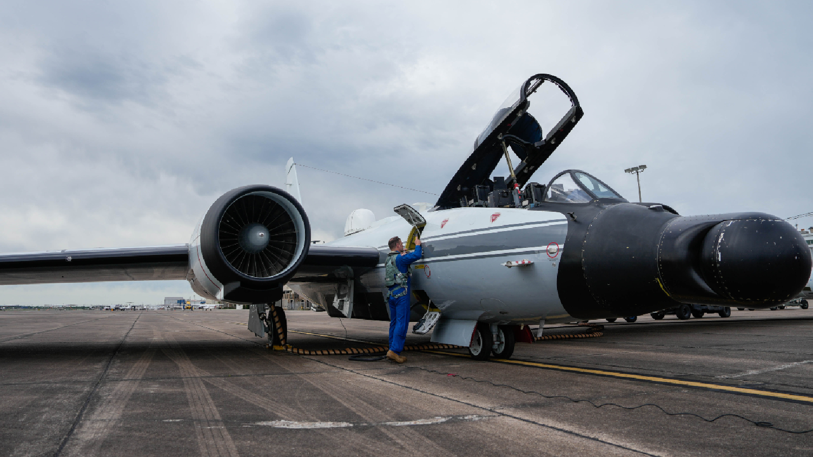 Photograph of the WB-57 jet on a runway being prepper for take off