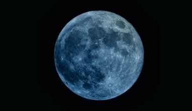 Image of a full moon with a blue hue for artistic effect. The moon doesn't turn blue during a "Blue Moon".