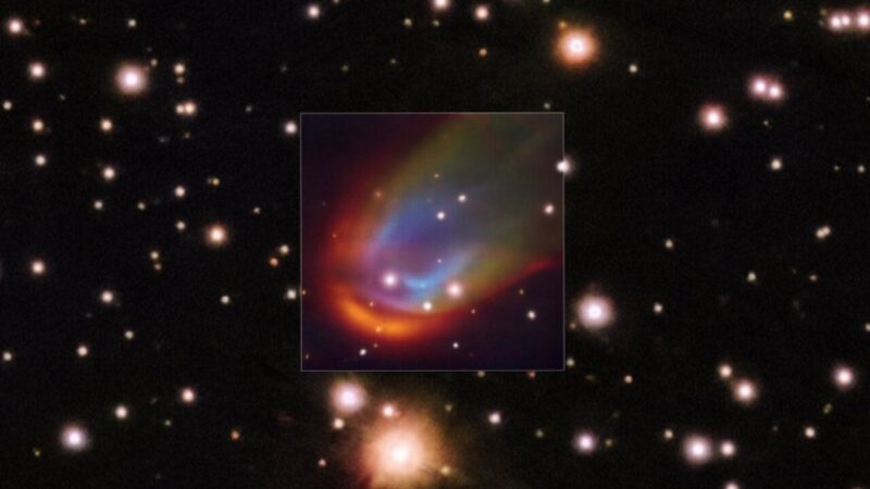 Against a starry background, an inset square shows a multicolored plume flowing to the top right from an unseen dead star.