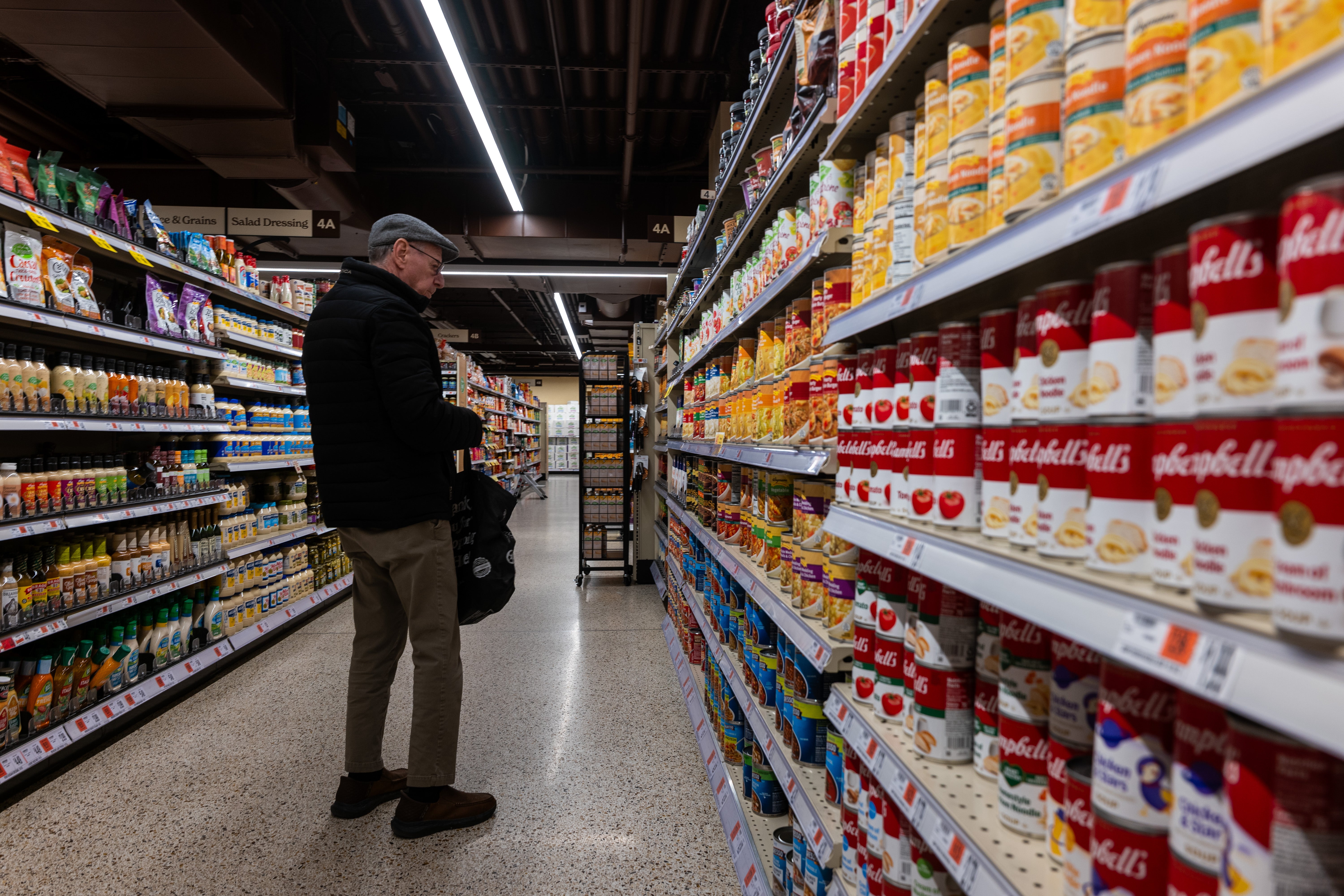 Canned soup and other goods are seen at a New York City grocery store in February 2025. Canned pea soup can offer about as much protein as a helping of cottage cheese