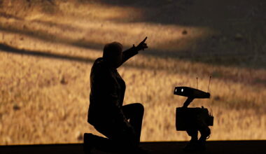 Nvidia founder and CEO Jensen Huang talks to a robot as he speaks during Nvidia Live at CES 2026 ahead of the annual Consumer Electronics Show in Las Vegas, Nevada, on January 5, 2026.