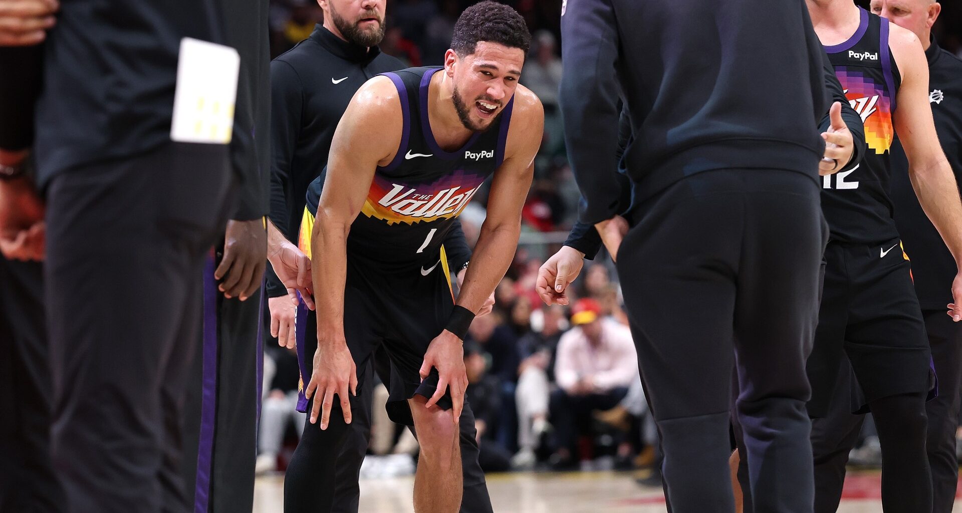 Suns guard Devin Booker exits with right ankle injury vs. Hawks, Jalen Green also hurt