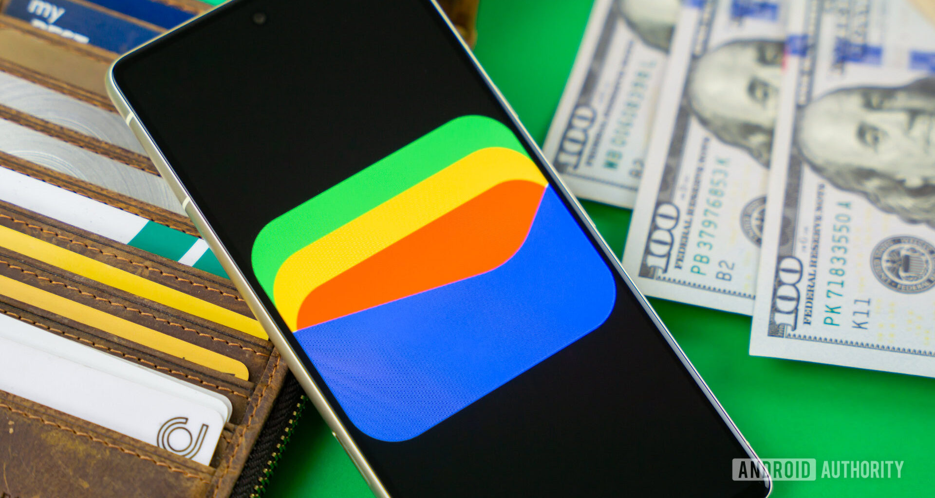 Google Wallet logo on smartphone next to credit cards and cash Stock photo 11