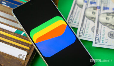 Google Wallet logo on smartphone next to credit cards and cash Stock photo 11