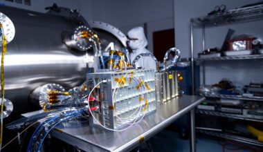 Spacecraft components configured for testing rest on a table.