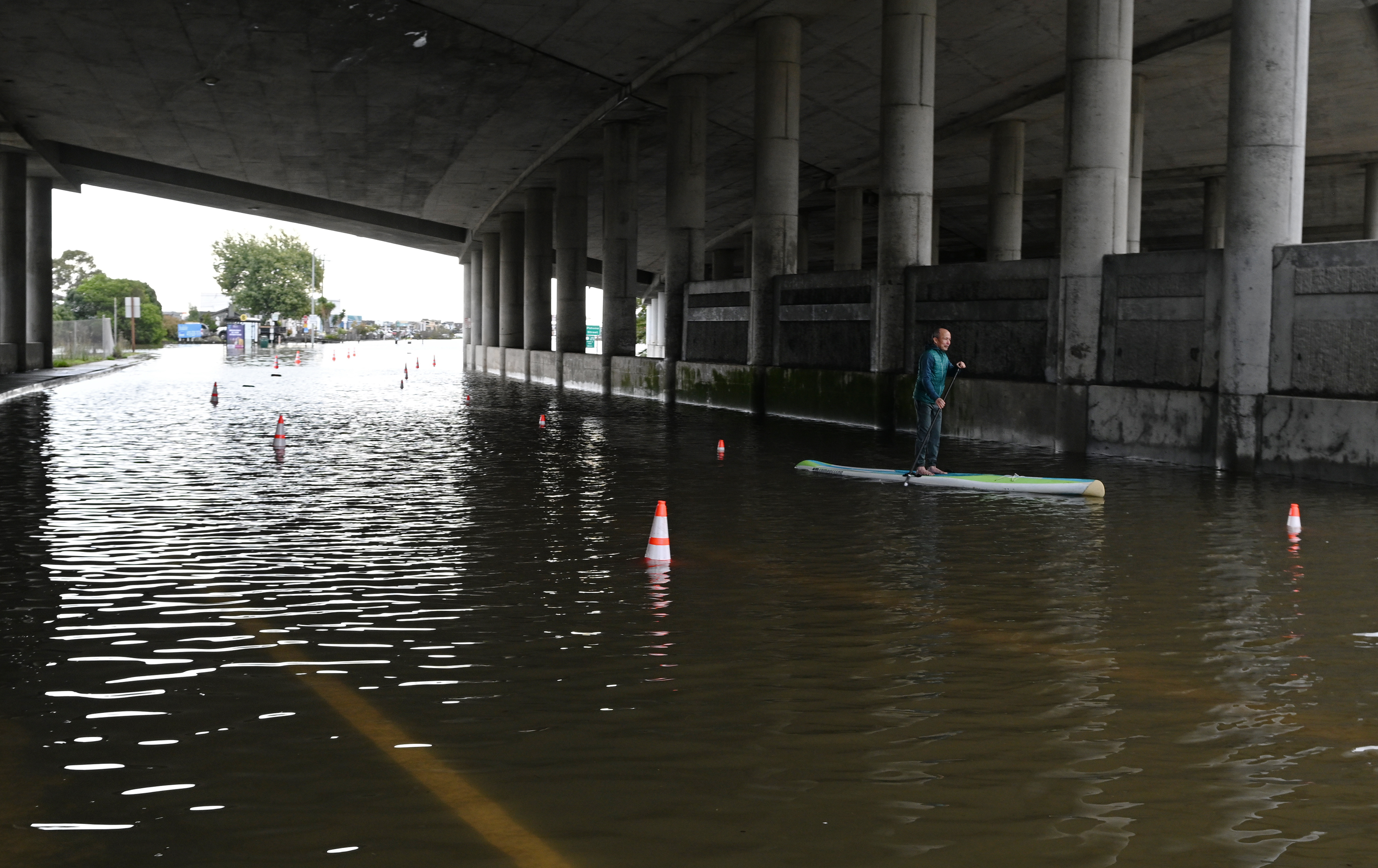 Jung Vu of Sausalito takes his paddleboard on the Shoreline...