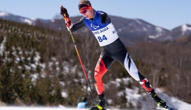 A male Para athlete is competing in Para cross-country skiing