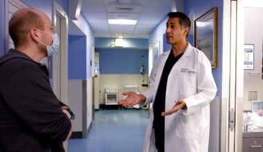 Dr. Ali Raja (right), executive vice chair of emergency medicine at Mass General Brigham, spoke to Paul Schneider, a certified physician assistant.