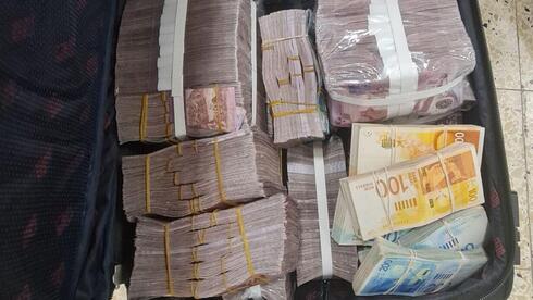 two Palestinians arrested trying to smuggle 12M shekels to terror